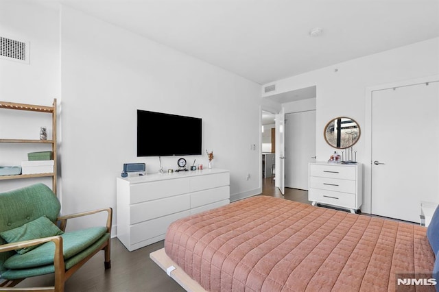 bedroom featuring dark wood-type flooring