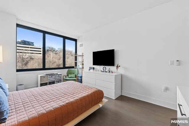 bedroom featuring dark wood-type flooring