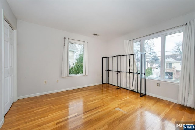 spare room with light hardwood / wood-style floors