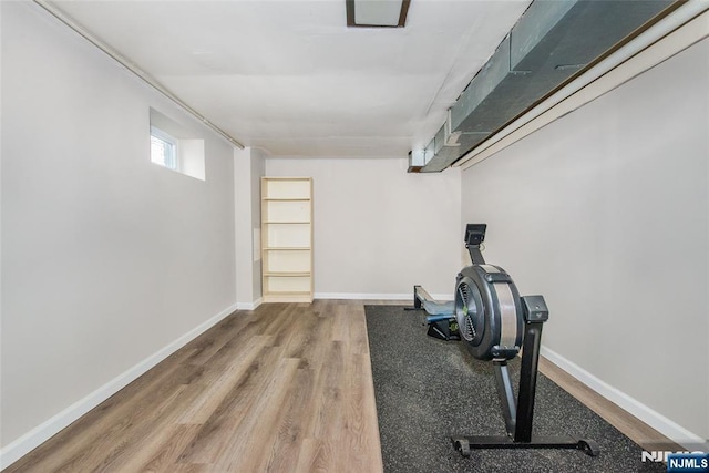 exercise area featuring hardwood / wood-style floors