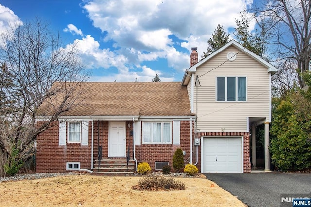 view of front of home with a garage