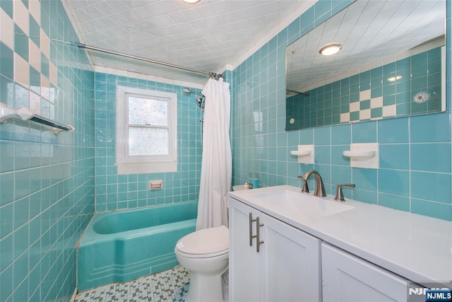 full bathroom featuring tile walls, toilet, vanity, and shower / bath combination with curtain