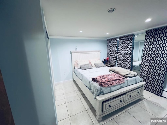 tiled bedroom featuring ornamental molding