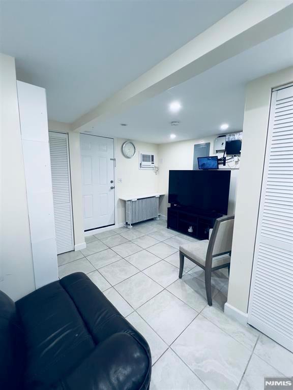 living room featuring light tile patterned floors