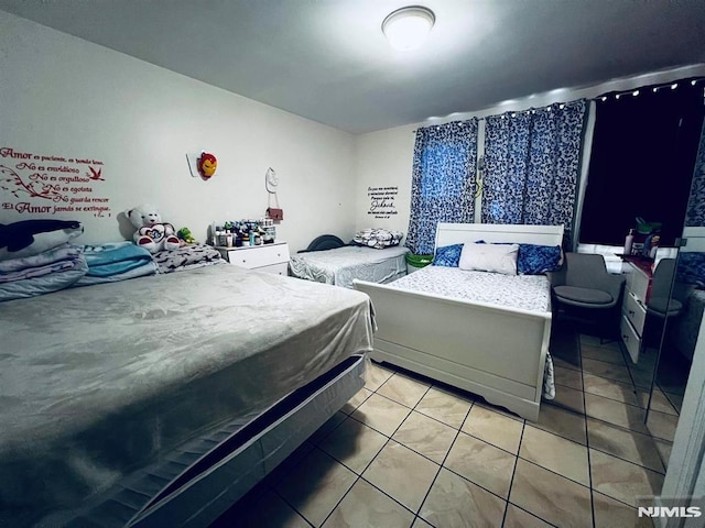 bedroom featuring tile patterned floors