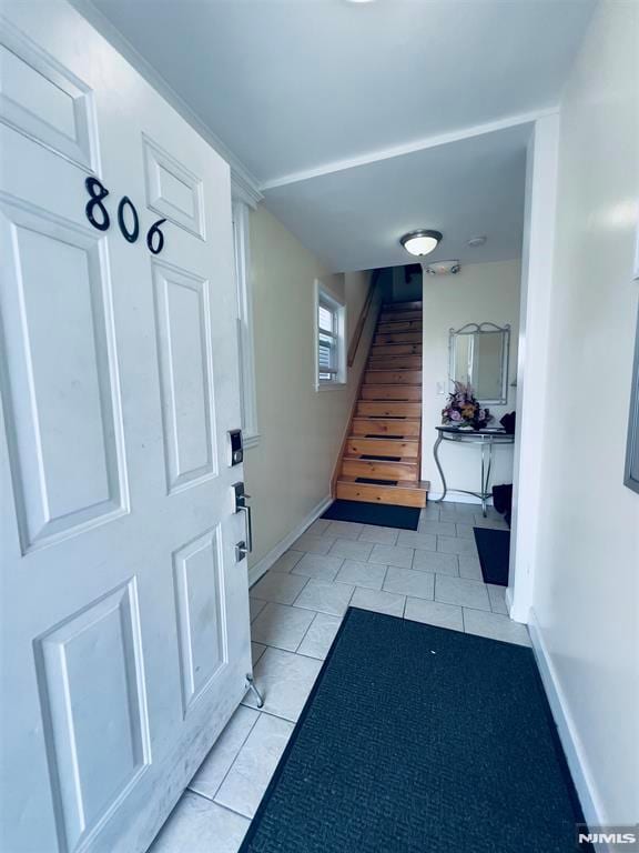 entrance foyer featuring light tile patterned flooring