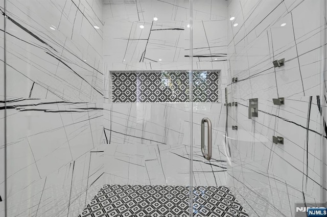 bathroom featuring a shower stall