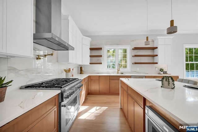 kitchen featuring wall chimney exhaust hood, appliances with stainless steel finishes, open shelves, and white cabinets