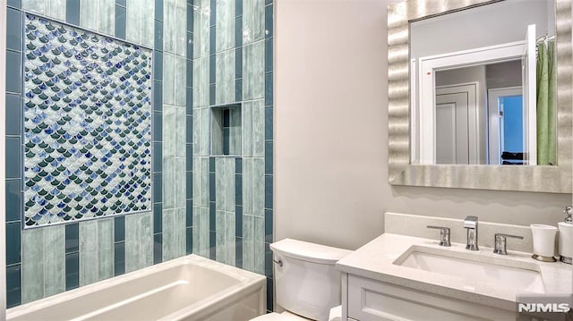 full bathroom featuring toilet, bathing tub / shower combination, and vanity