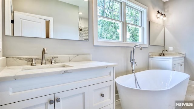 bathroom featuring a bathtub and vanity