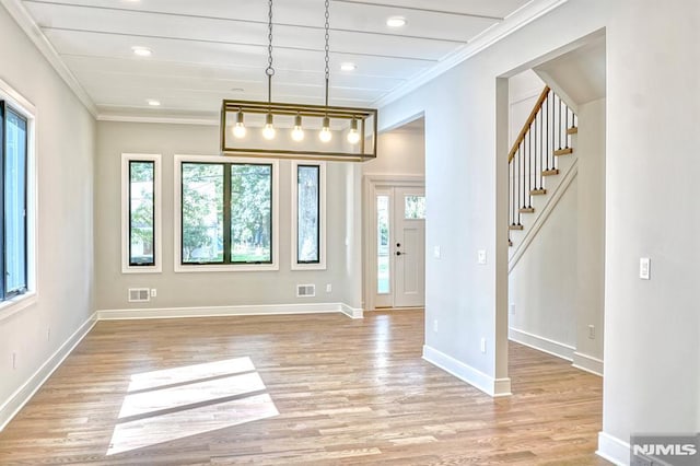 interior space with light wood-type flooring and ornamental molding