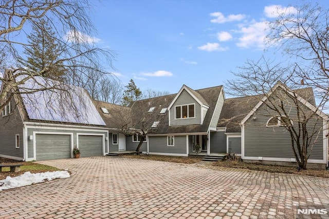 cape cod house with a garage