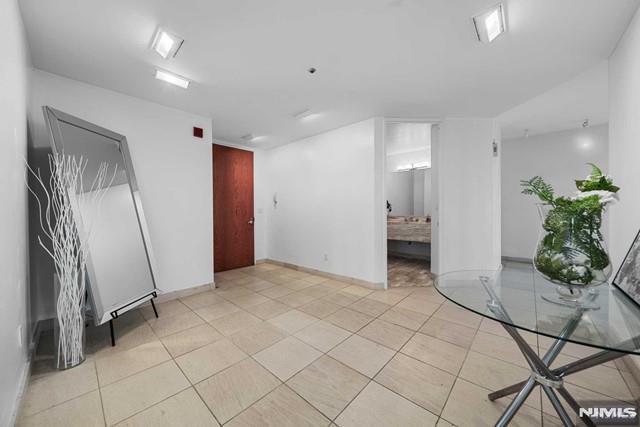 empty room with light tile patterned floors