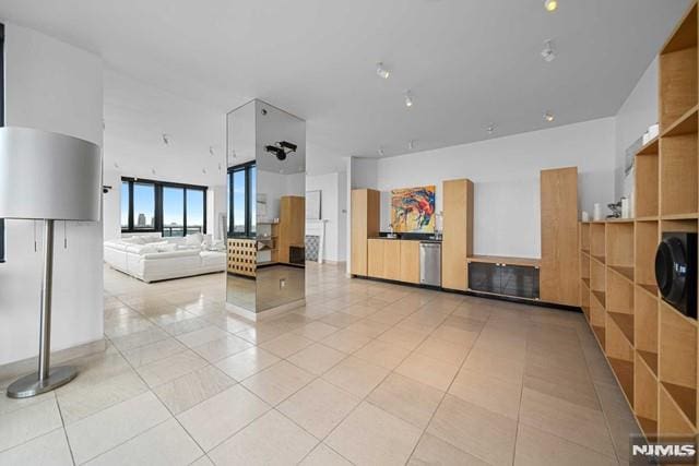 kitchen with dishwasher and light tile patterned flooring