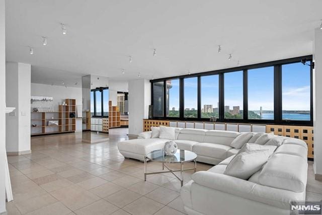 tiled living room with a water view