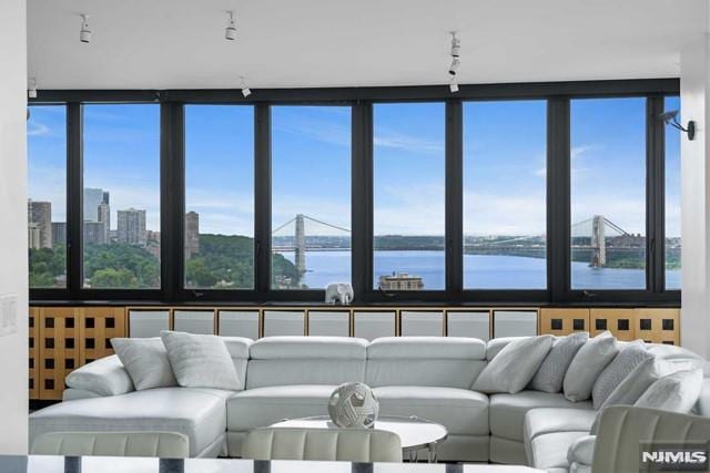 living room featuring a water view