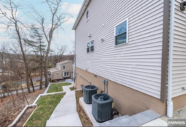 view of home's exterior with cooling unit