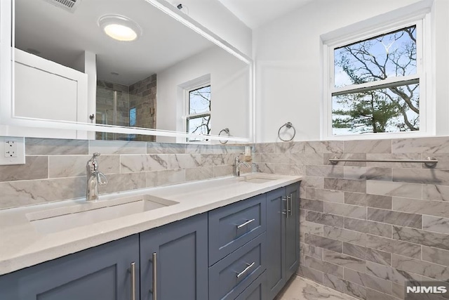 bathroom with vanity and tile walls