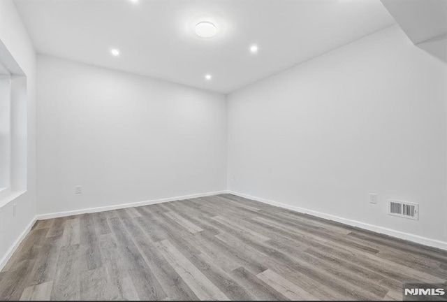 spare room with light wood-type flooring