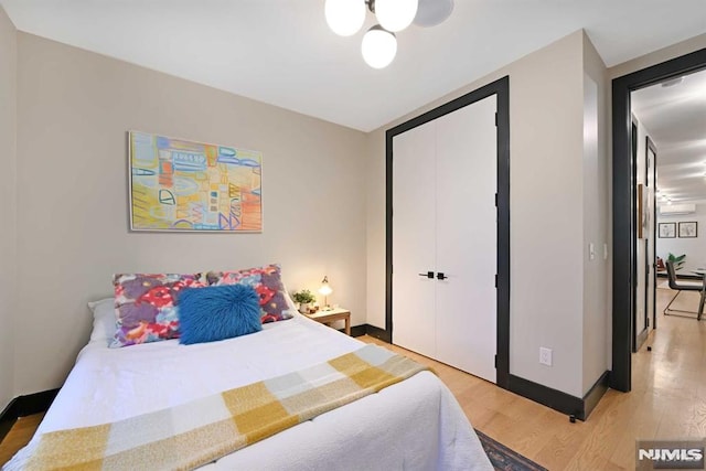 bedroom with a closet and light wood-type flooring