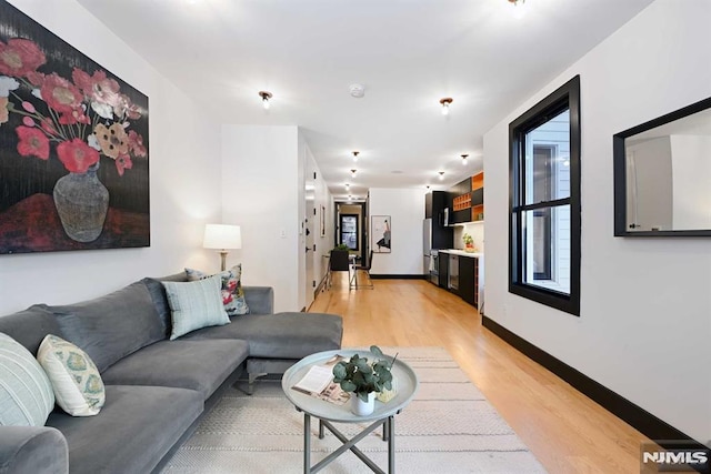 living room with light hardwood / wood-style floors