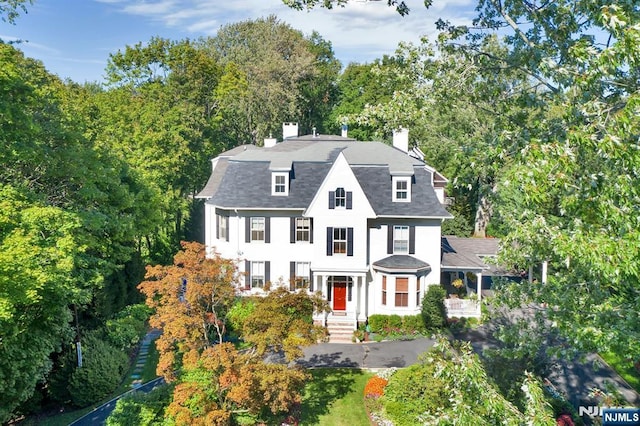 view of front of home featuring a chimney