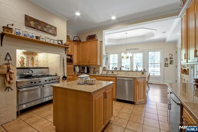 kitchen with an inviting chandelier, light tile patterned floors, appliances with stainless steel finishes, a kitchen island, and tasteful backsplash