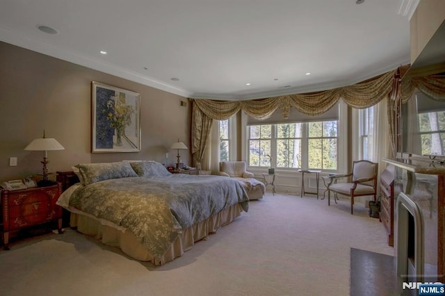 bedroom with recessed lighting, light carpet, and crown molding