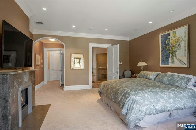 bedroom featuring crown molding, visible vents, baseboards, and light carpet