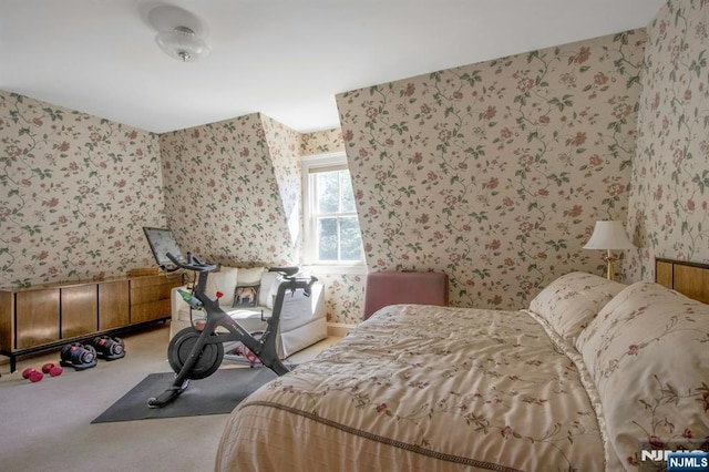 carpeted bedroom featuring wallpapered walls