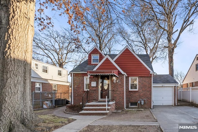 view of front facade featuring a garage and an outdoor structure