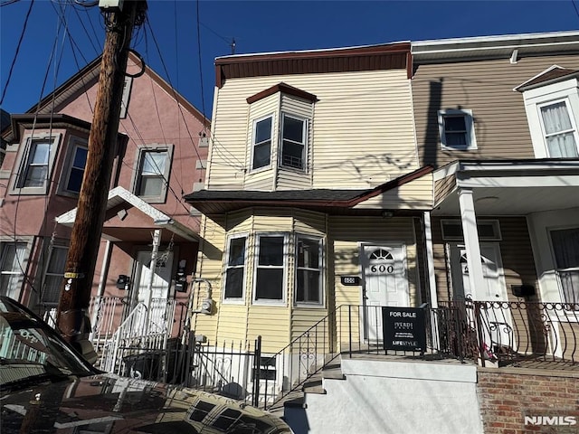 view of property featuring central AC unit