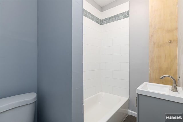 full bathroom with vanity, shower / bathtub combination, and toilet