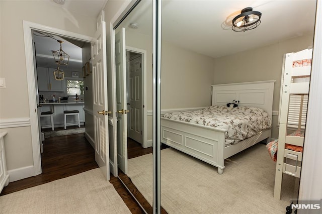 bedroom with hardwood / wood-style floors