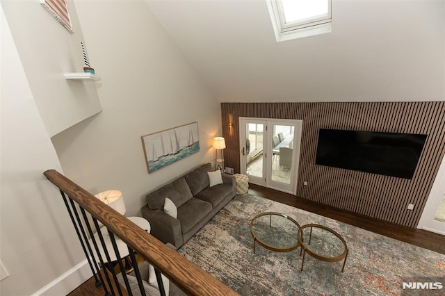 living room featuring dark hardwood / wood-style floors and lofted ceiling