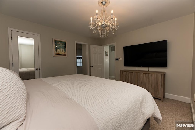 carpeted bedroom with an inviting chandelier