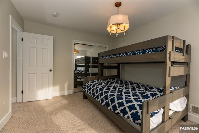 carpeted bedroom featuring a closet