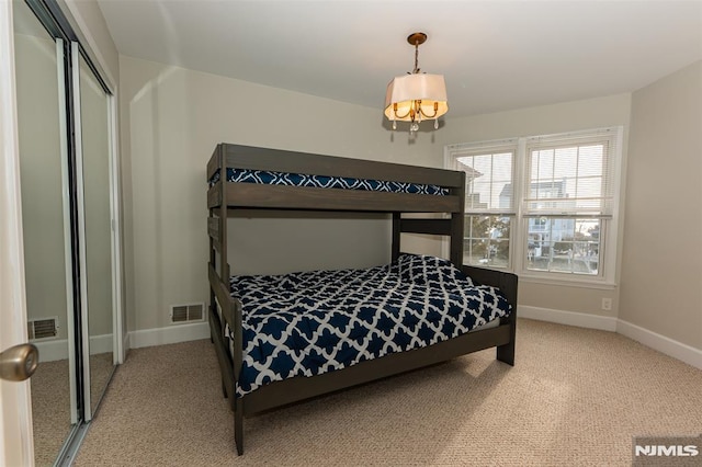 bedroom with a closet and carpet floors