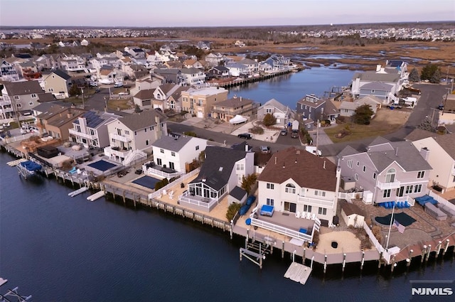 aerial view at dusk with a water view