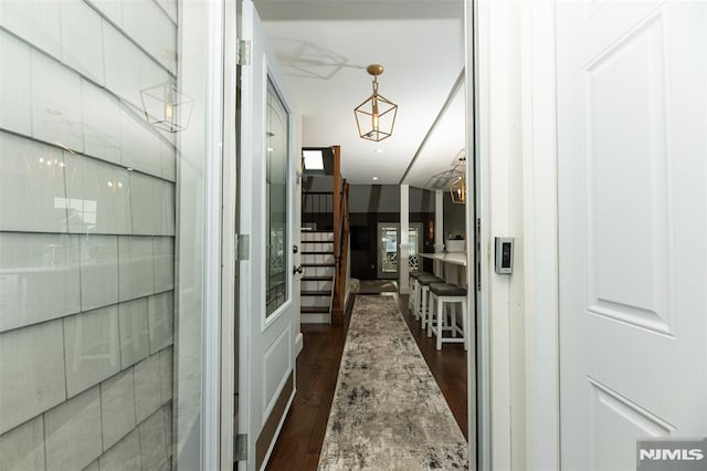 corridor featuring dark hardwood / wood-style flooring