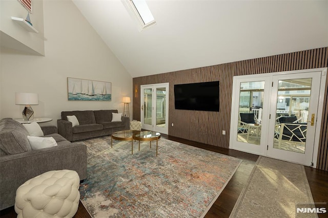 living room featuring dark wood-type flooring and high vaulted ceiling