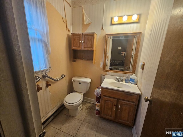 bathroom with tile patterned floors, toilet, and vanity