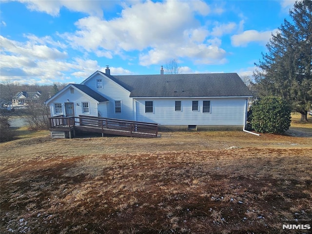 back of property featuring a deck