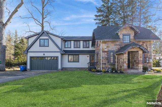 view of front of house featuring a garage and a front lawn