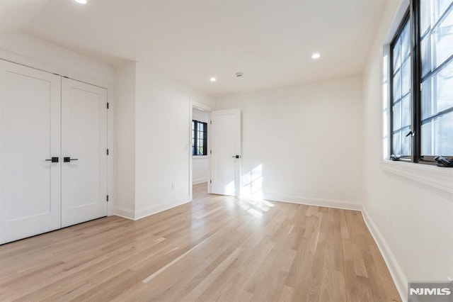 spare room featuring light hardwood / wood-style flooring