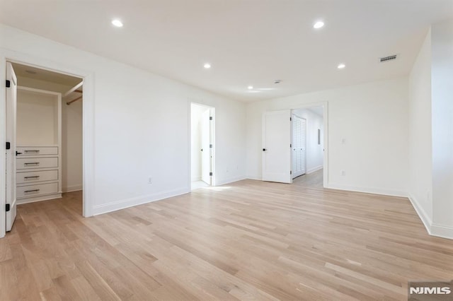 unfurnished room with light hardwood / wood-style flooring