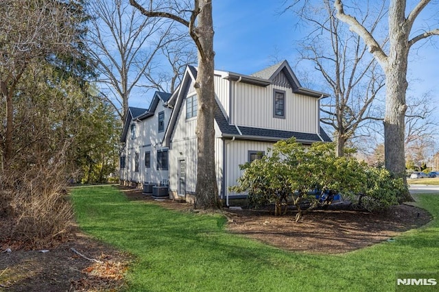 view of property exterior with a lawn