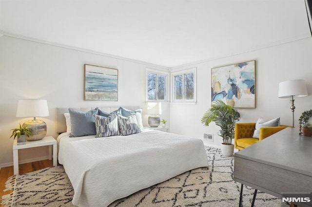 bedroom with wood-type flooring