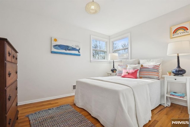 bedroom with hardwood / wood-style flooring