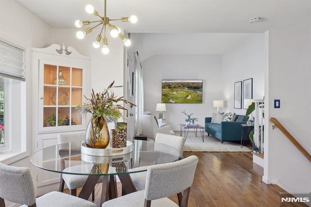 dining space featuring an inviting chandelier and wood-type flooring